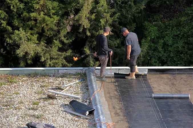 Réalisation de réparation d'infiltration de toit-terrasse 2